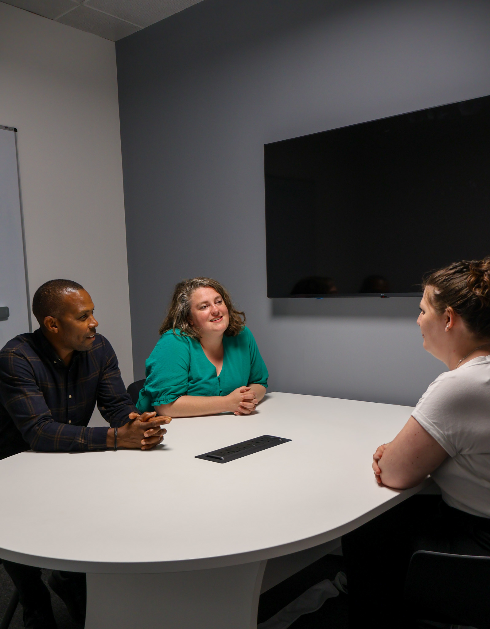 A focused Signet Resources professional attentively participating in a recruitment discussion.