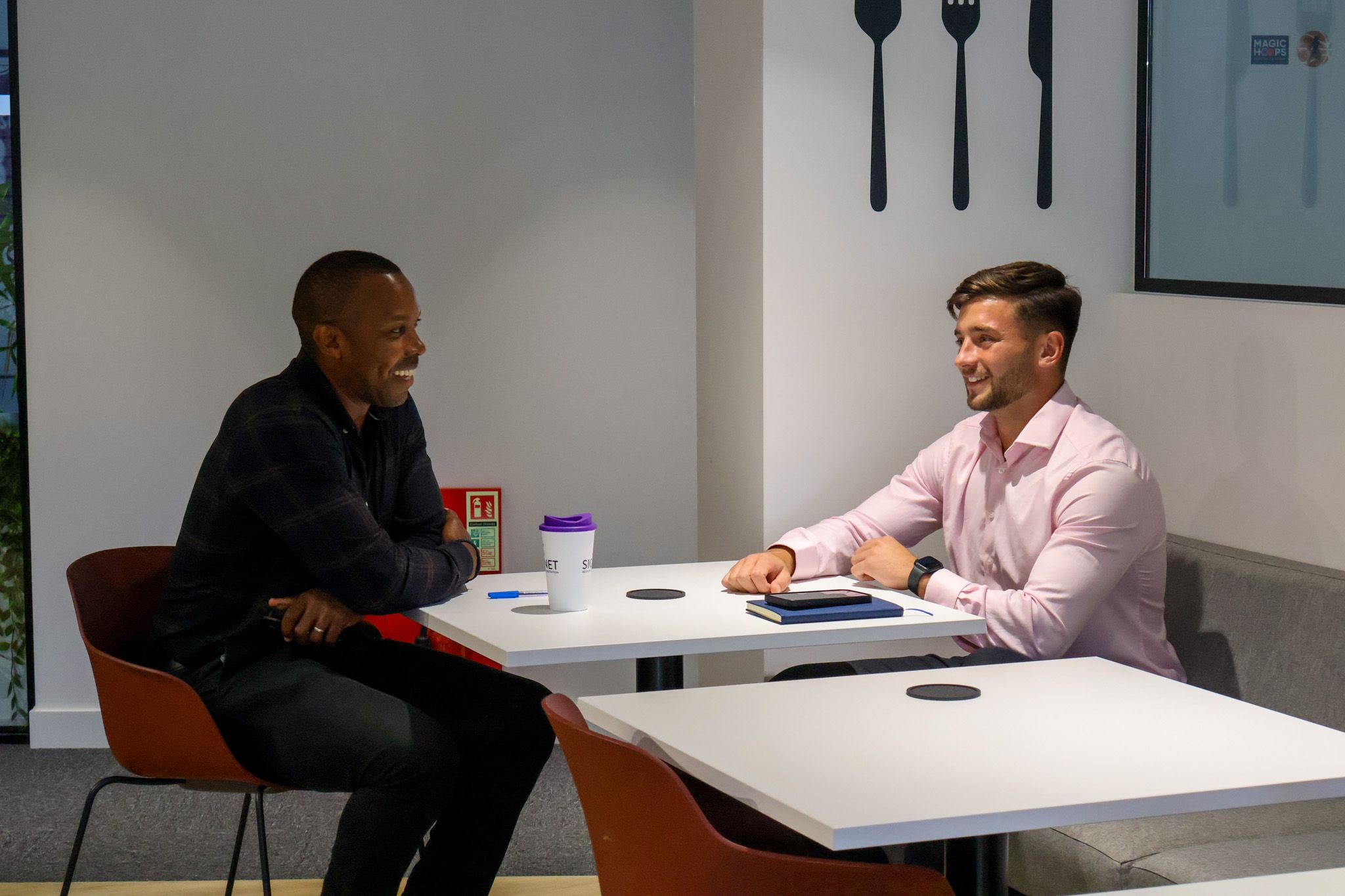 A focused Signet Resources professional attentively participating in a recruitment discussion.