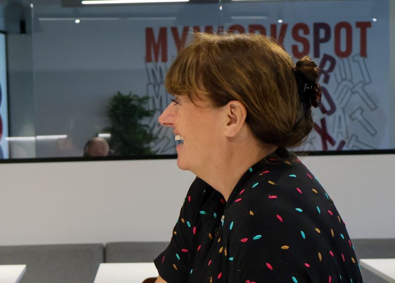 A Signet Resources employee working diligently on recruitment correspondences, immersed in the multitasking demands of her role.