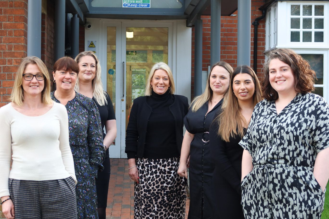 The Signet Recruitment and Retention team poised confidently outside their office, showcasing the diverse professionals behind their successful recruitment services.