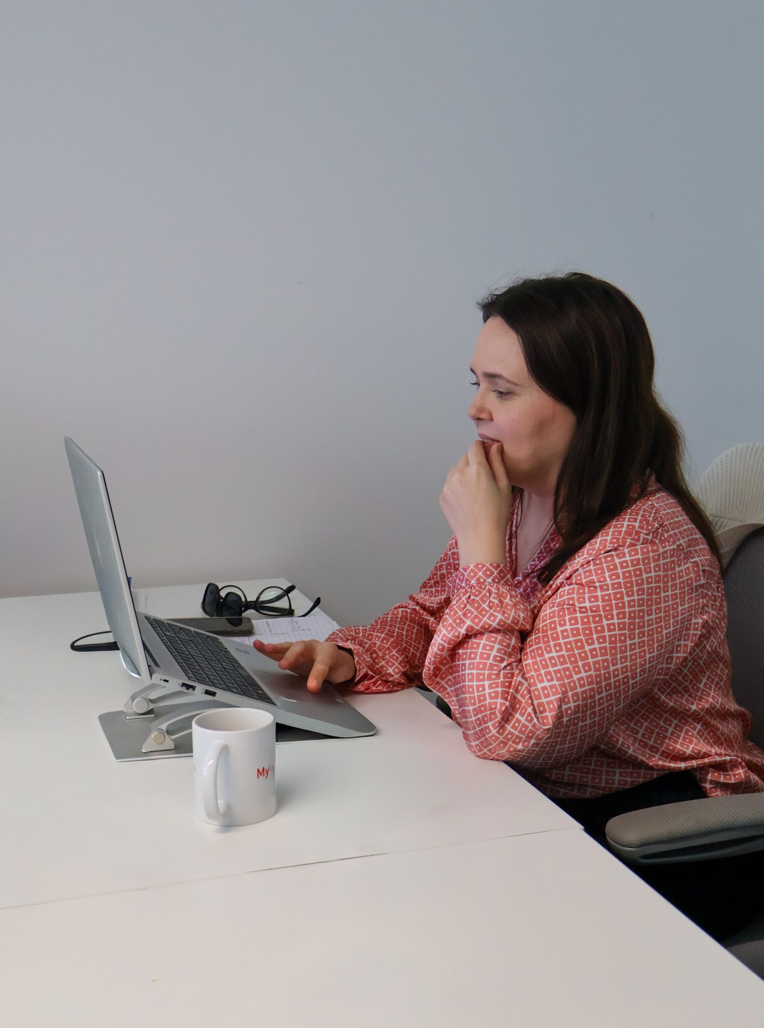 A focused Signet Resources professional attentively participating in a recruitment discussion.