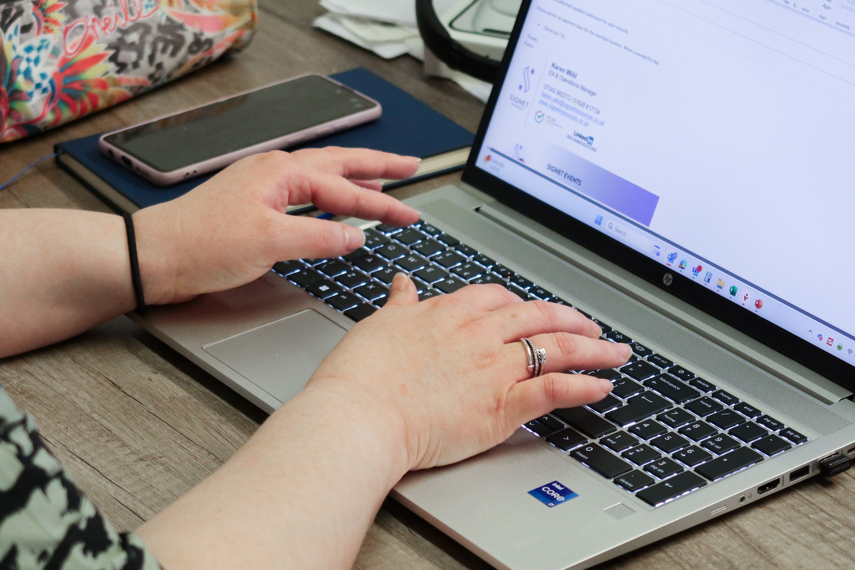 Close-up of a professional at Signet Resources managing recruitment tasks on a laptop, indicative of modern hiring processes.