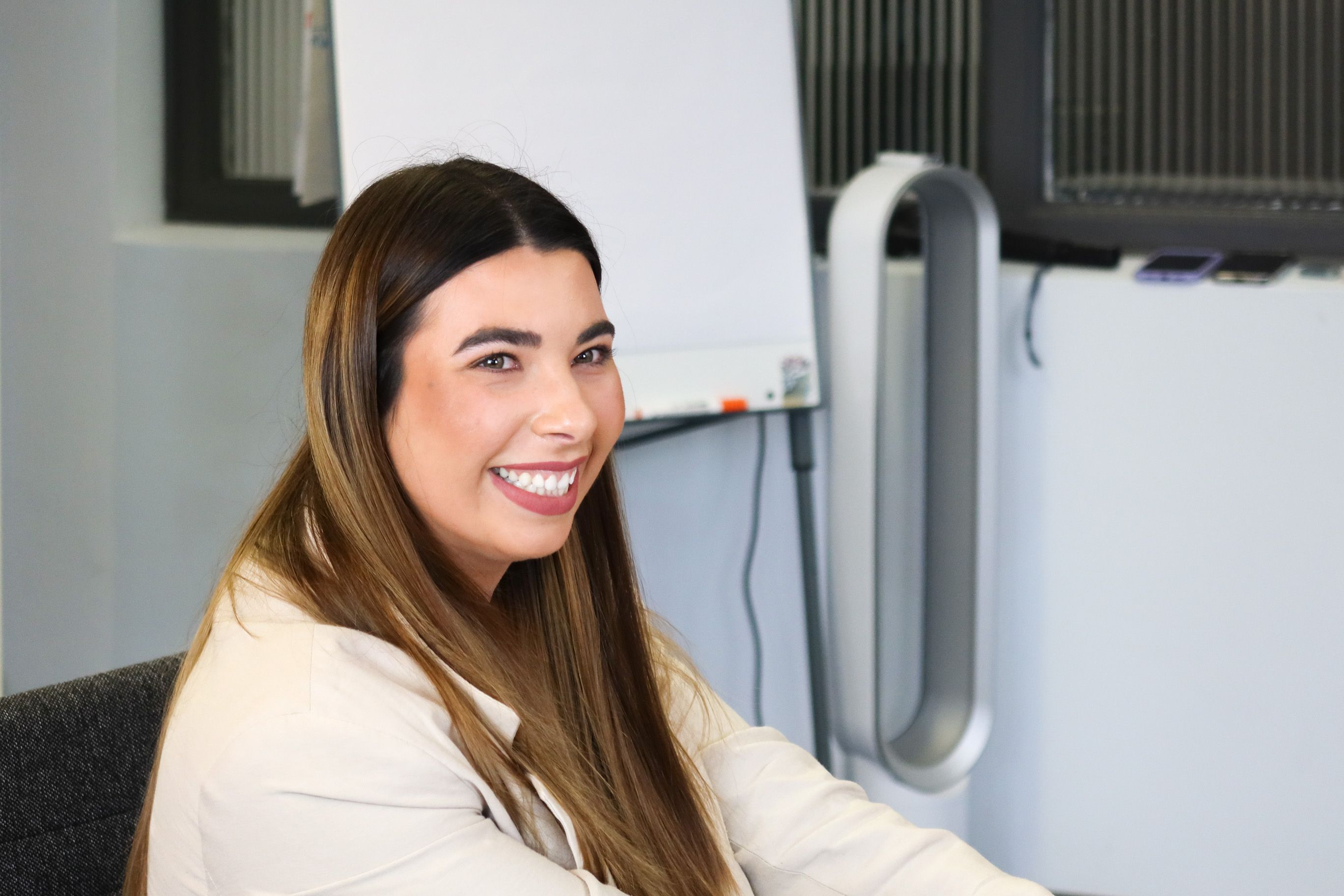 A Signet Resources team member with a welcoming smile, indicating a friendly and professional recruitment environment.