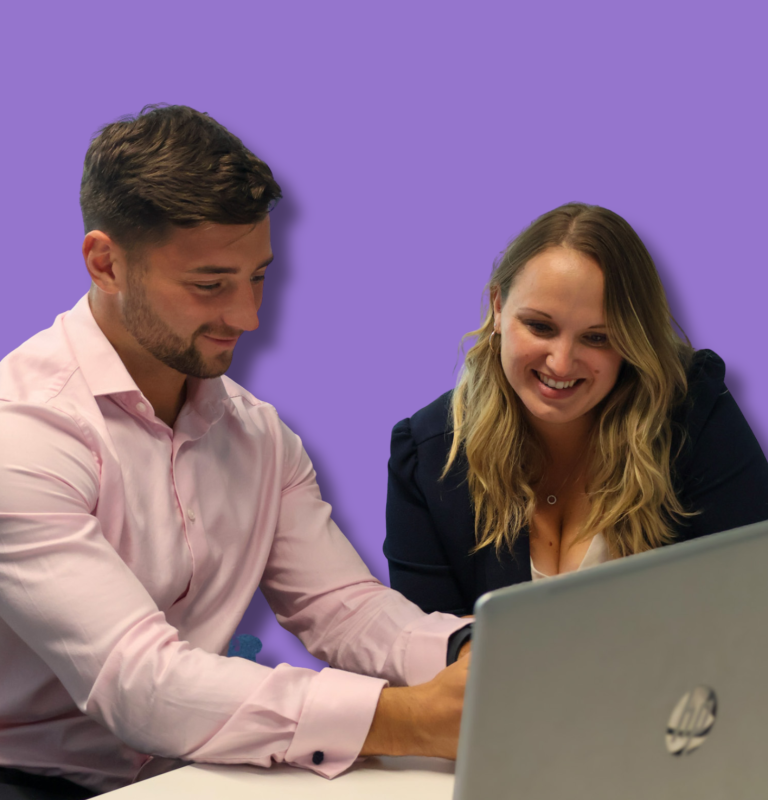 Signet Resources staff member viewing a presentation slide about team passion and enjoyment on a laptop, emphasising a positive work culture.