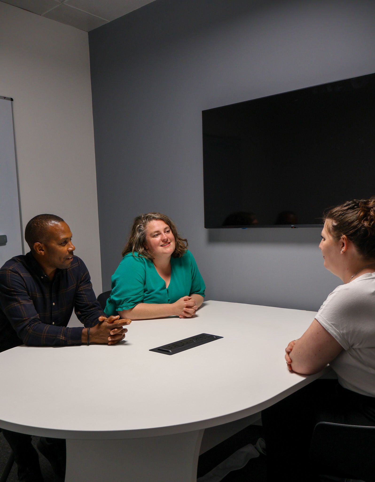 A focused Signet Resources professional attentively participating in a recruitment discussion.